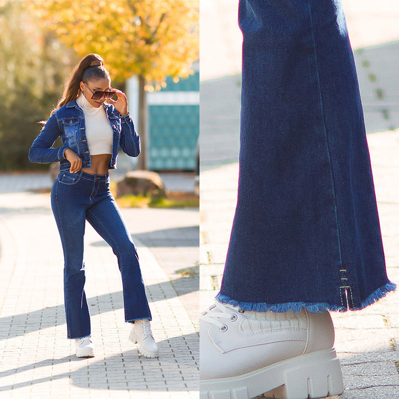 Seksowne jeansy z ciemnego denimu z przetarciami